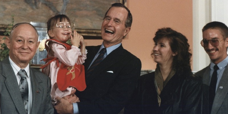 photograph of Jessica with President George H. W. Bush